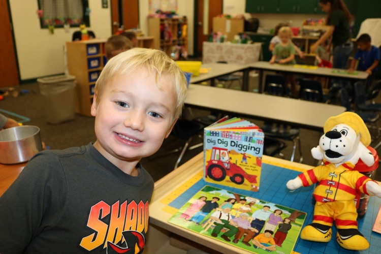 student showing puzzle is finished