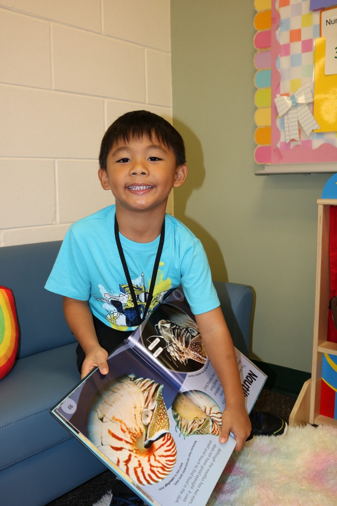 student holding book