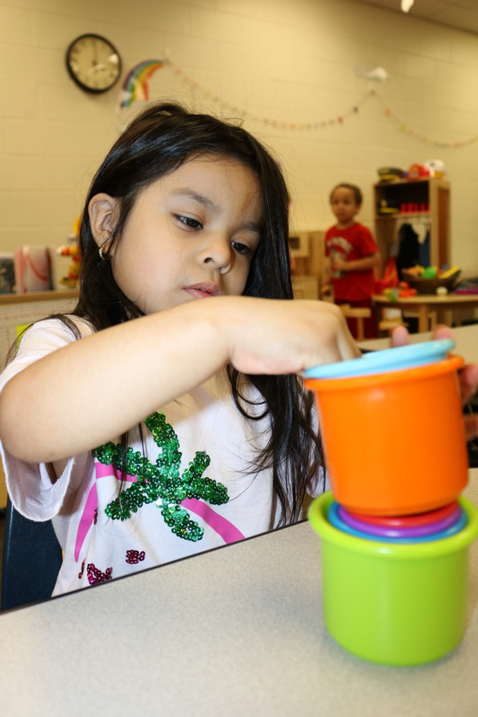 student playing with toys in vpk