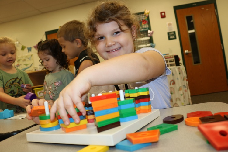 student playing with blocks