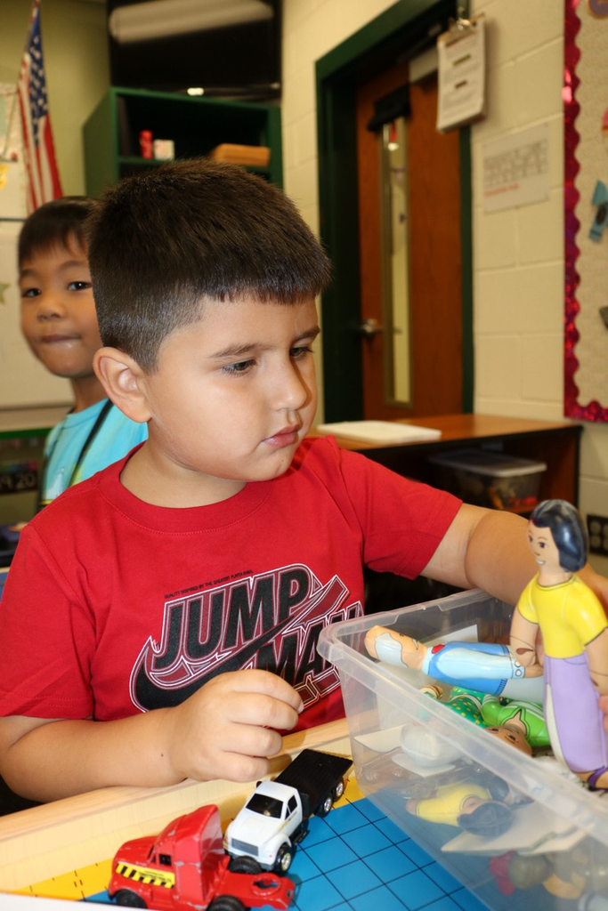 student playing with toys