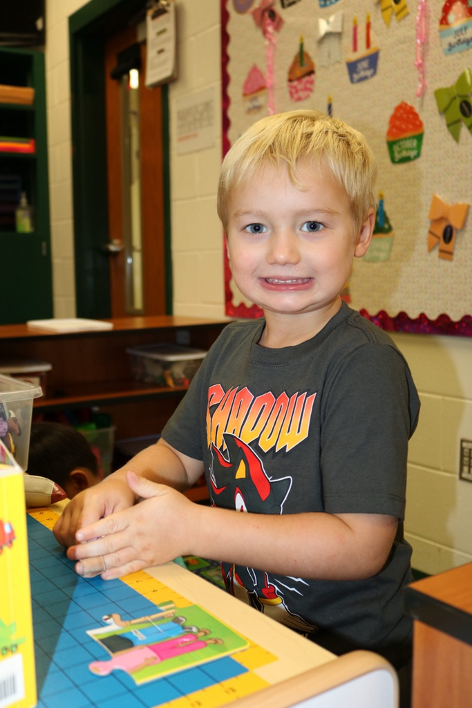 student playing and smiling