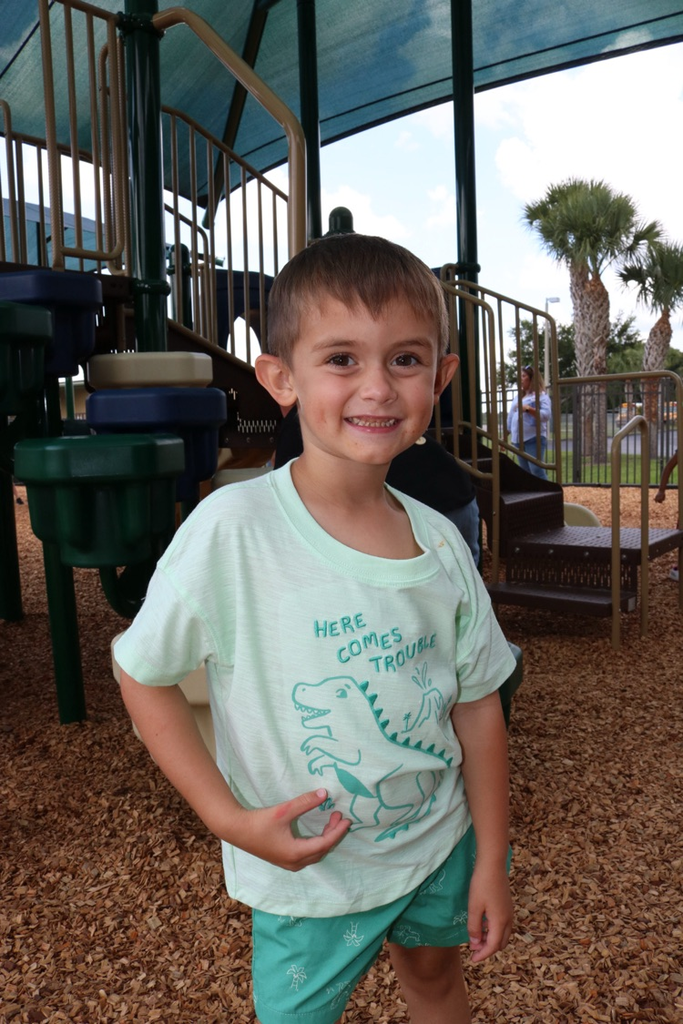 student smiling at playground