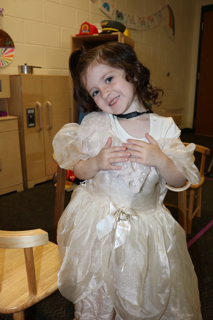 student smiling with princess dress on