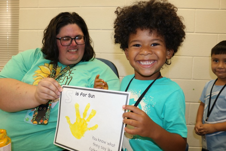 student showing his hand art
