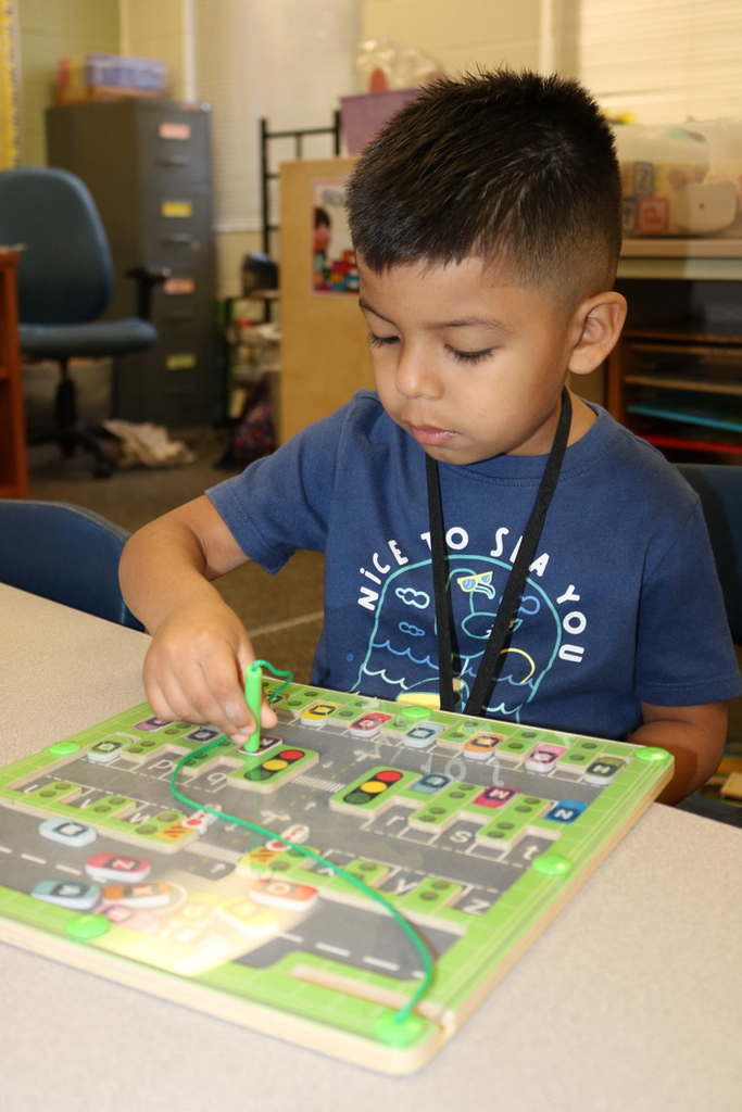 student playing with magnet toy