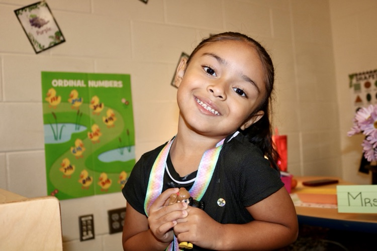 student smiling in class
