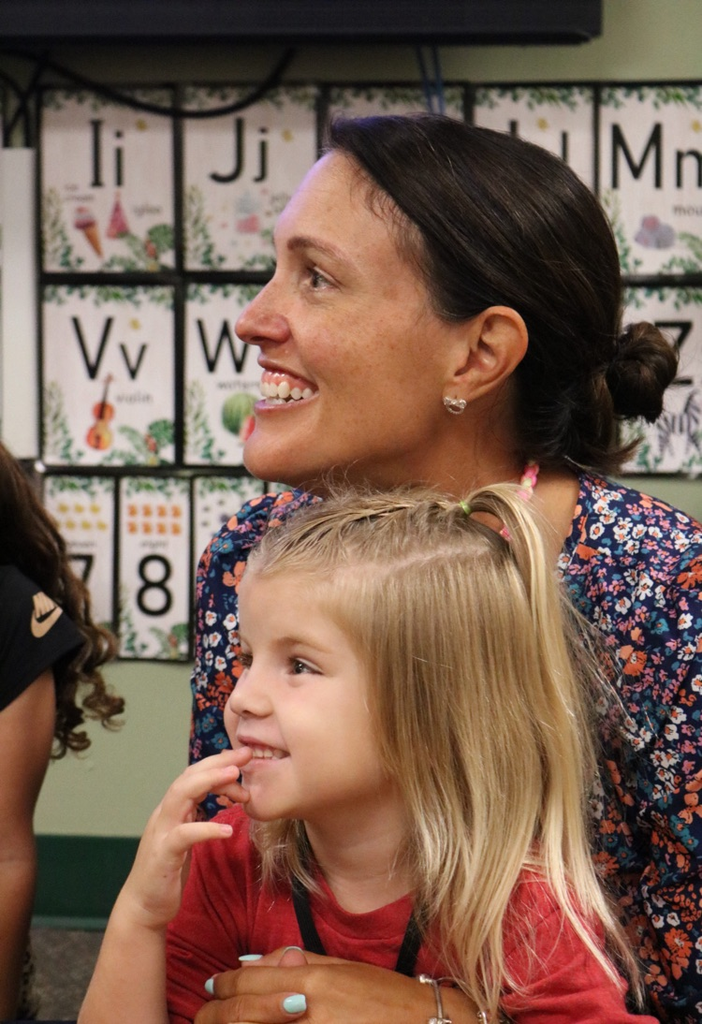 teacher hugging student
