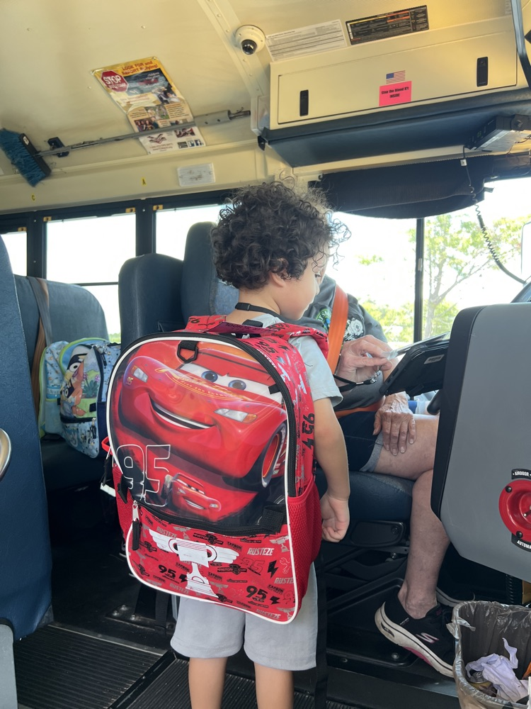 student getting on the bus