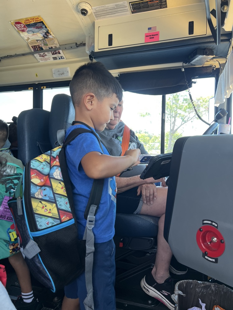 student getting on the bus