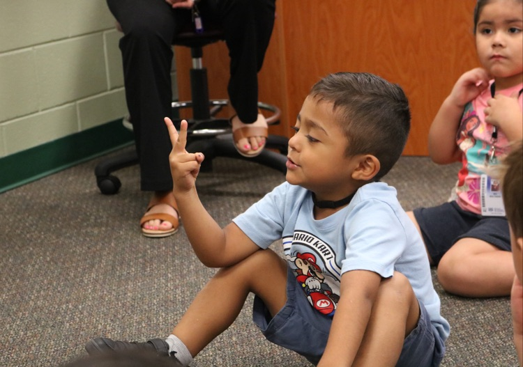 student counting on his fingers 