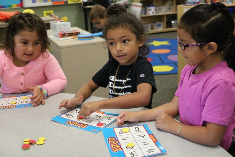 three students playing bingo