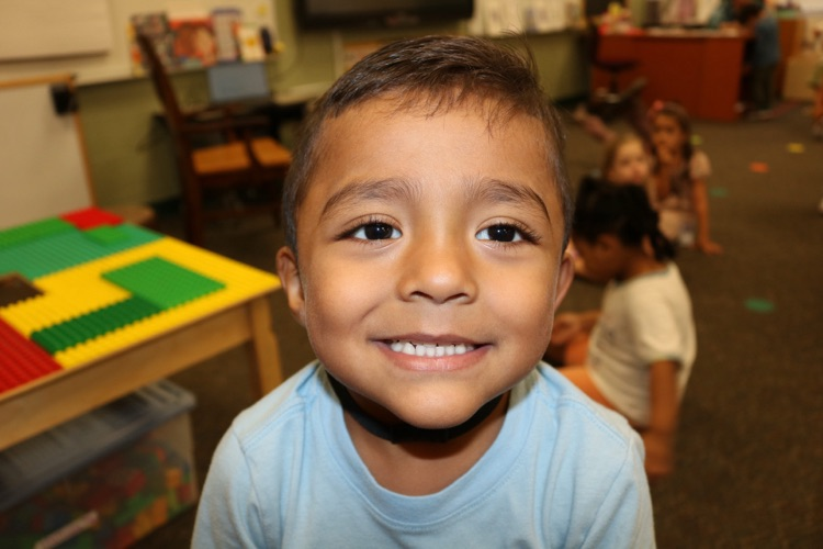 student smiling in prek class