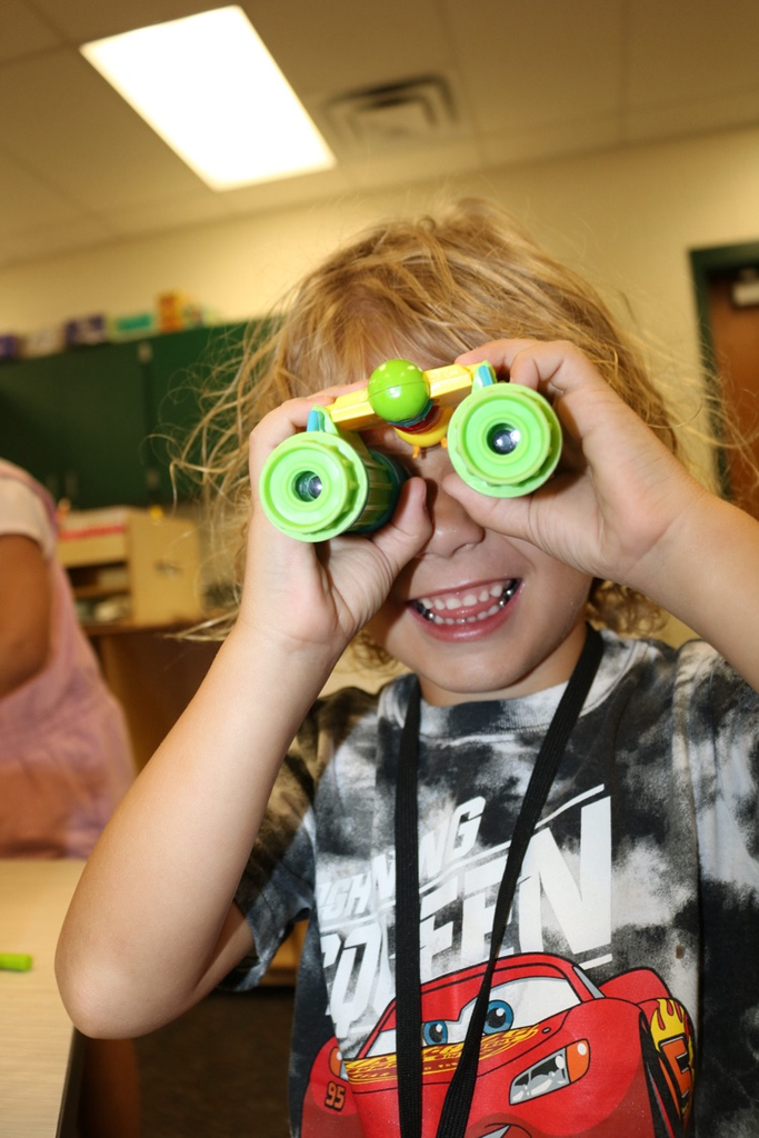 student playing with microscopes