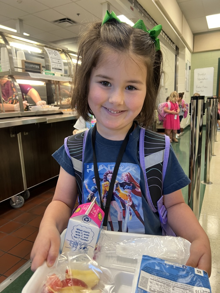 student wearing blue in cafe for spirit day 