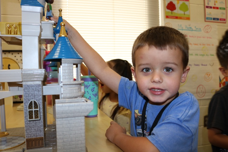 boy playing with castle 