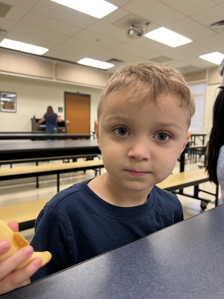 student wearing blue at breakfast 