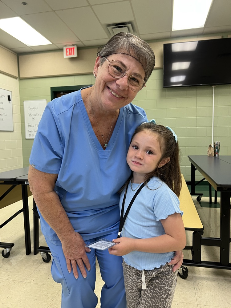 student and cafeteria lady 
