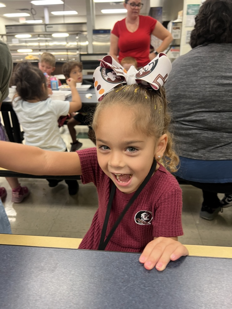 prek student smiling in breakfast