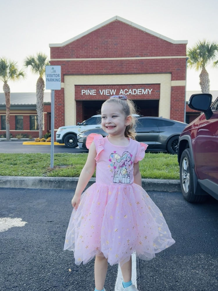 prek student infront of pine view academy school 