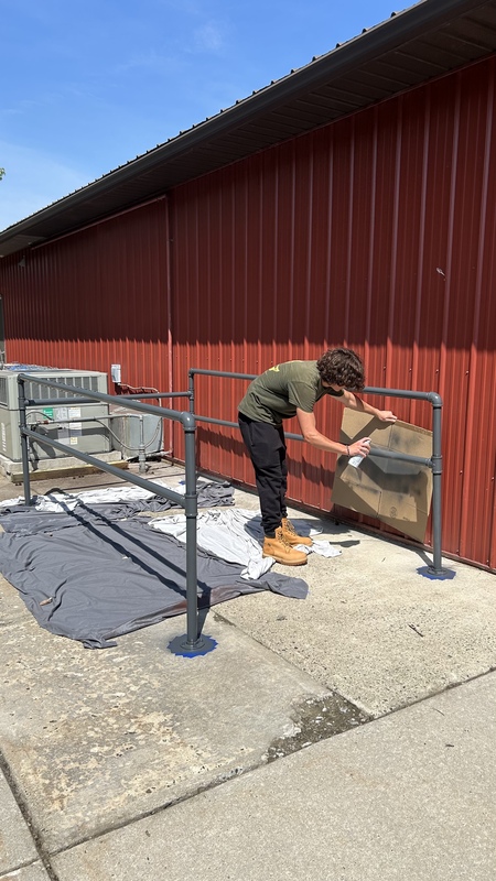 Daniel Gavrikov, a member of Boy Scout Troop 219 in Old Bridge, has completed a new shopping cart corral for the Food Bank as part of his Eagle Scout project.