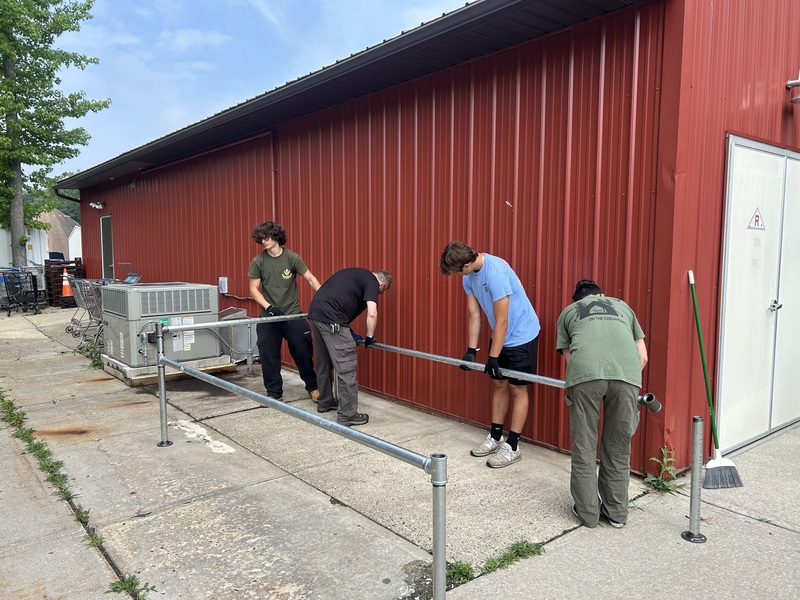 Daniel Gavrikov, a member of Boy Scout Troop 219 in Old Bridge, has completed a new shopping cart corral for the Food Bank as part of his Eagle Scout project.