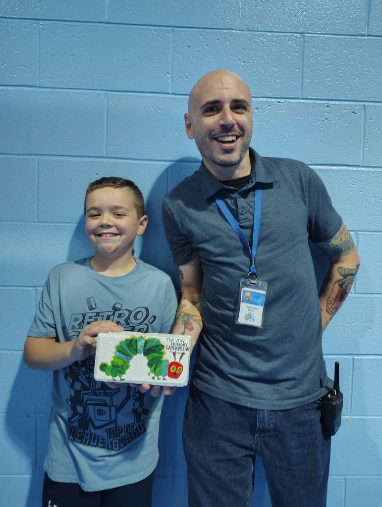 Students with the talented artists who painted book bricks for our Pollinator Rain Garden fundraiser.