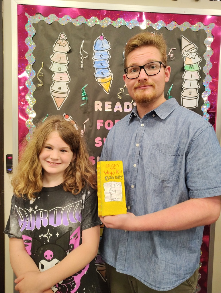 Students with the talented artists who painted book bricks for our Pollinator Rain Garden fundraiser.