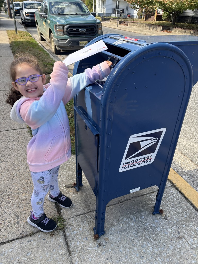 Kindergartner mailing her letter to her friend
