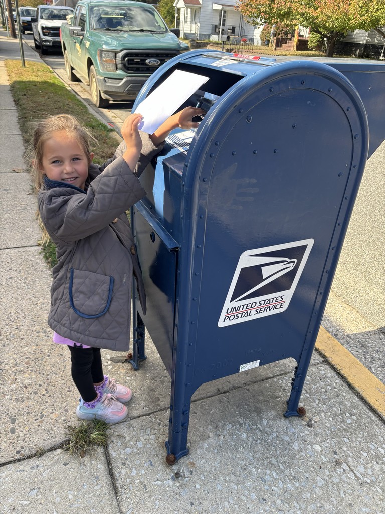 Kindergartner mailing her letter to her friend