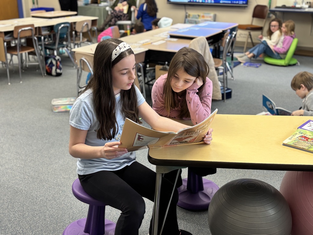 3rd and 4th grade buddy reading to celebrate Read Across America Day!