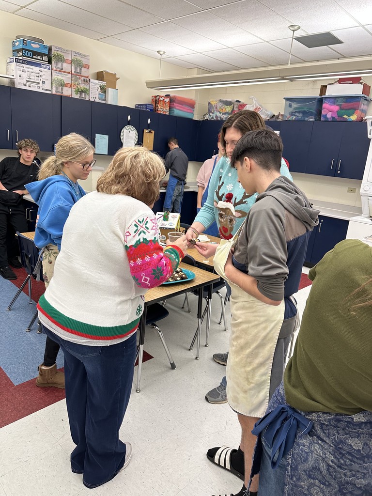 Staff and students discussing the cookies.