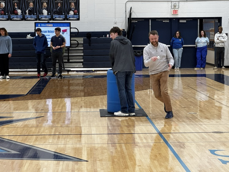 Mr. Greene running the barrel race relay  