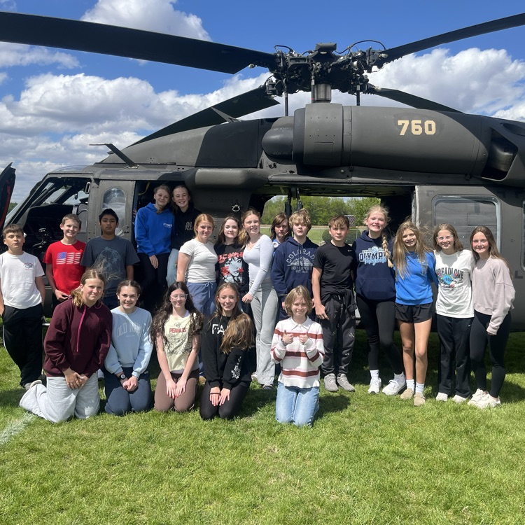 students exploring a helicopter 