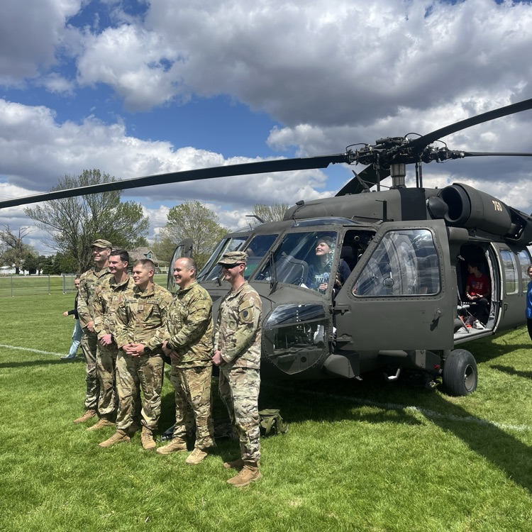 students exploring a helicopter