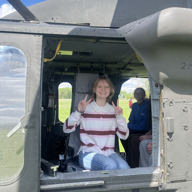 students exploring a helicopter 