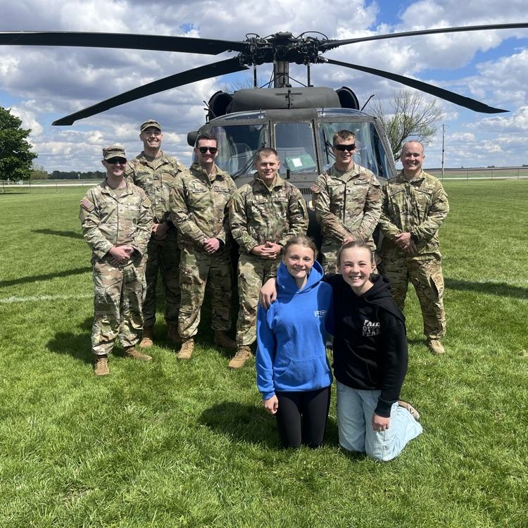 students exploring a helicopter