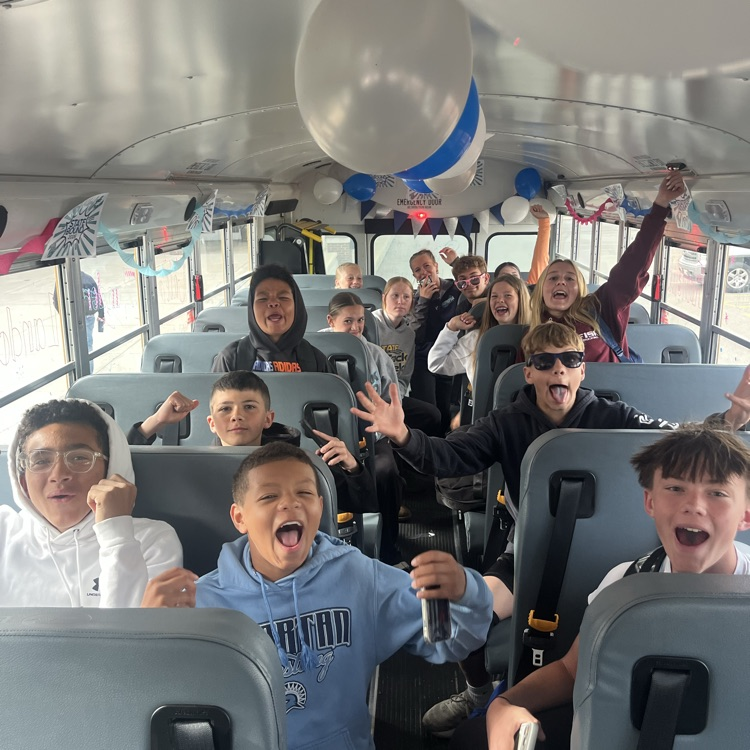 kids celebrating on bus