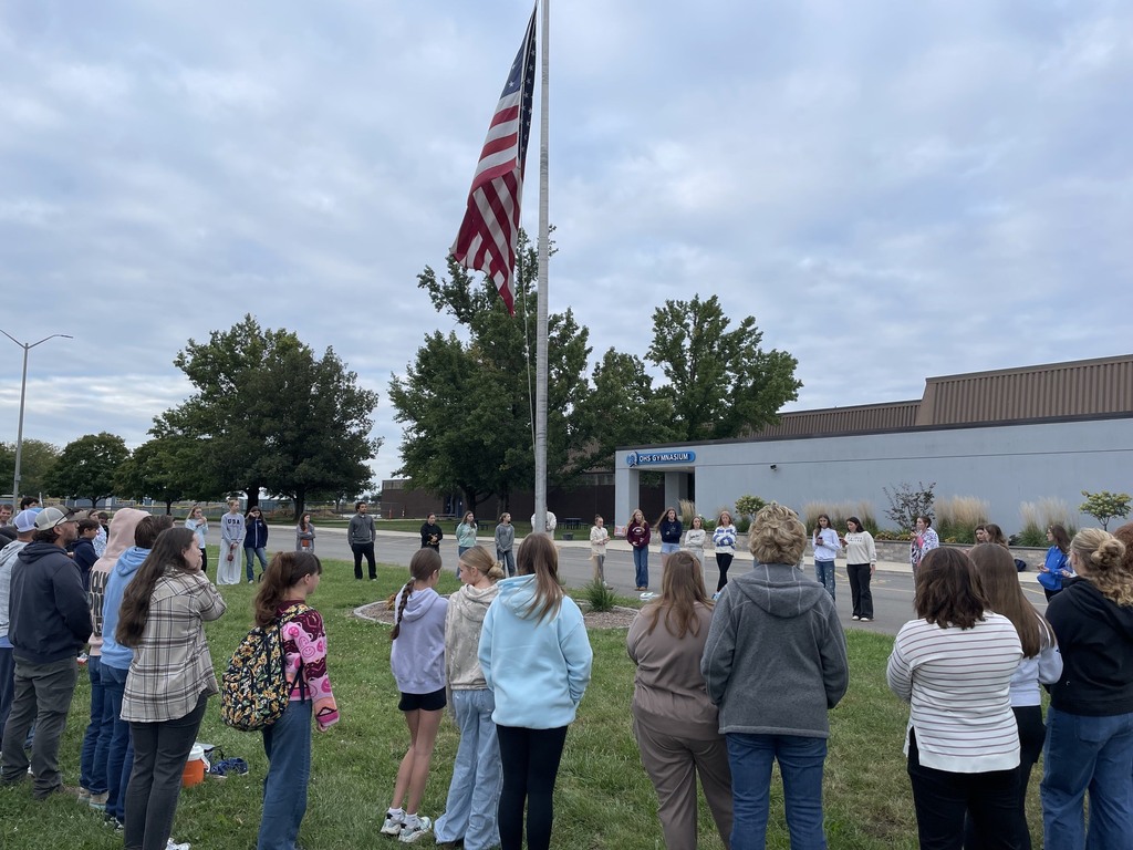 OHMS students and staff gather at the flag pole
