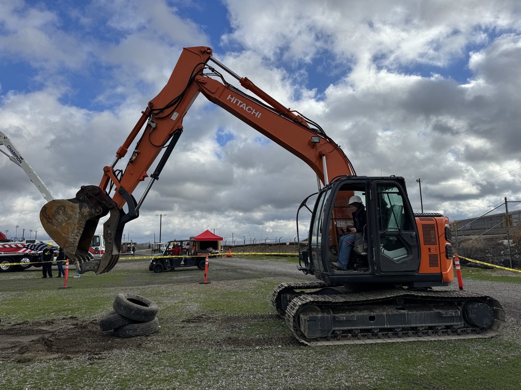 OHS Students stacking tires with a trackhoe!