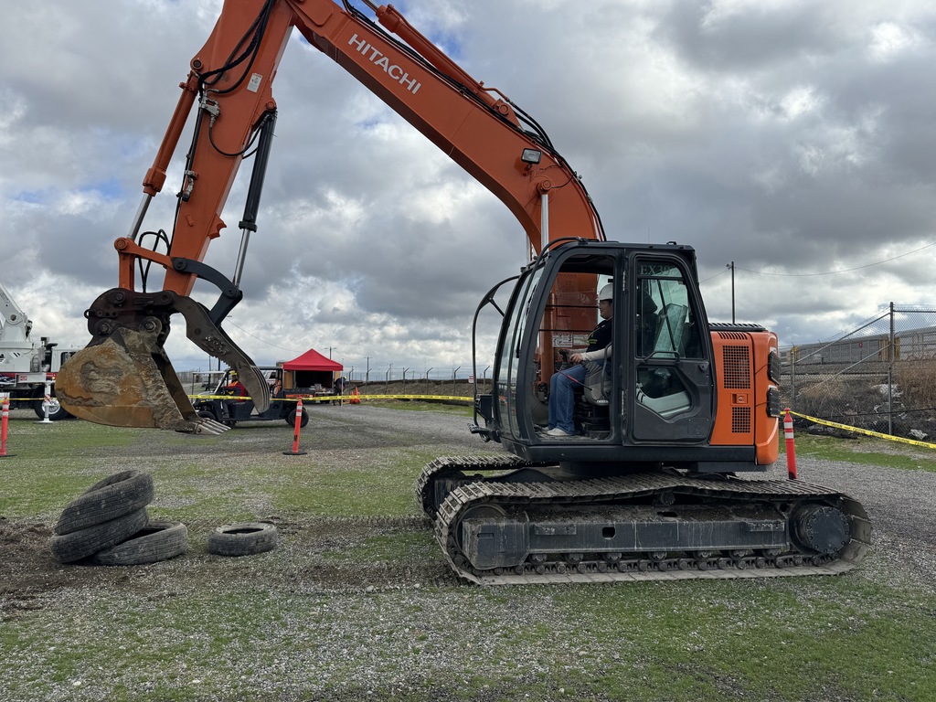 OHS Students stacking tires with a trackhoe!
