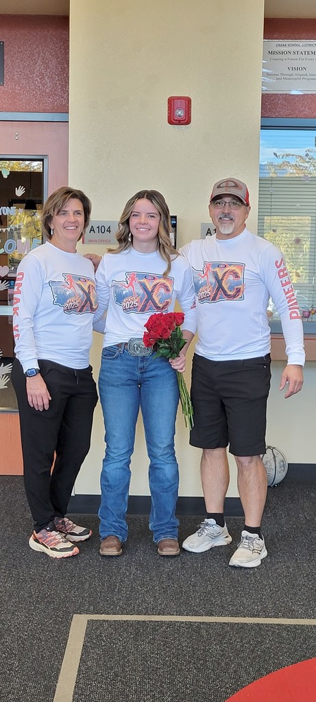 Sage Buhrig, pictured here with her coaches (and parents) Sean Kato and Shelby Bohrman Kato