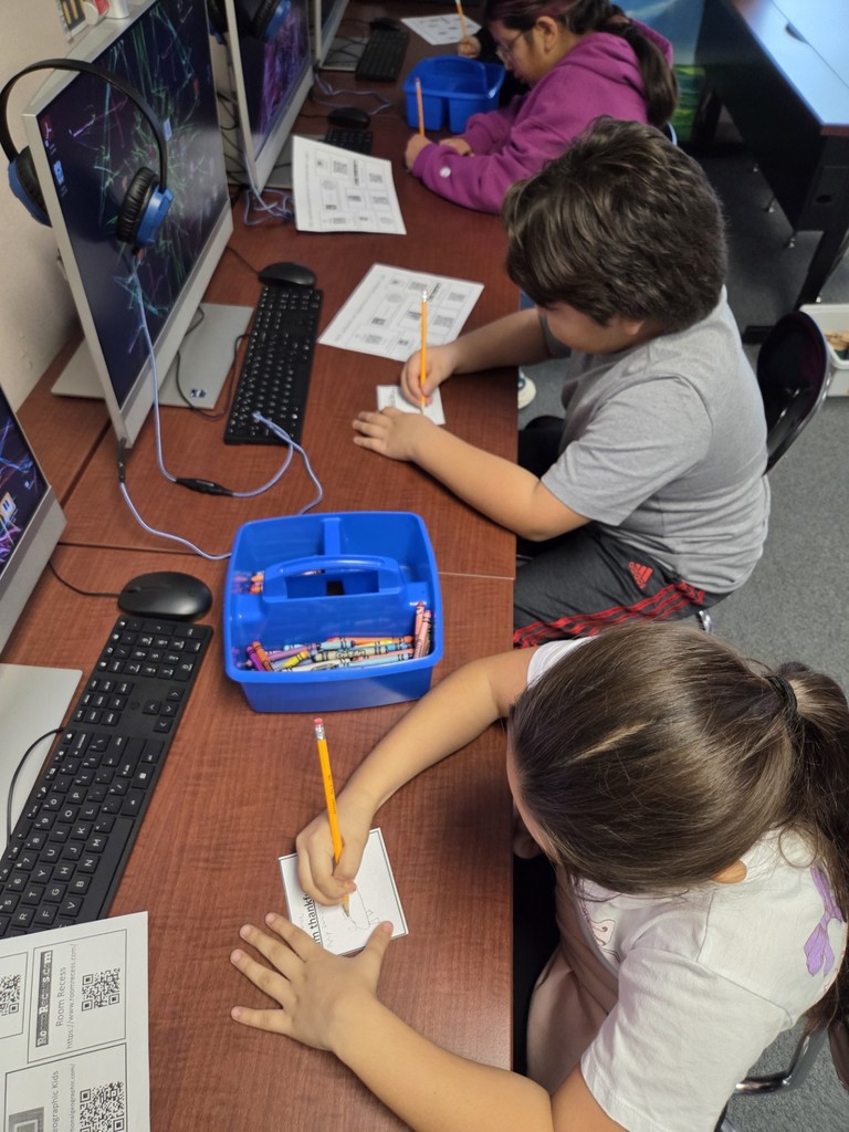 North Elementary students drawing and writing about what they are thankful for.