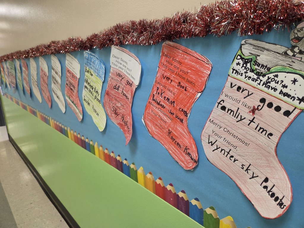The 2nd grade hall at North Elementary is lined with stockings listing what students would like for Christmas.