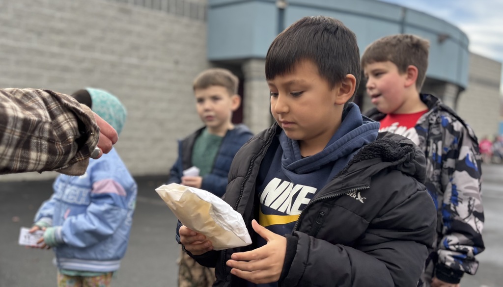 Kindergarten Students wait in line patiently for their turn