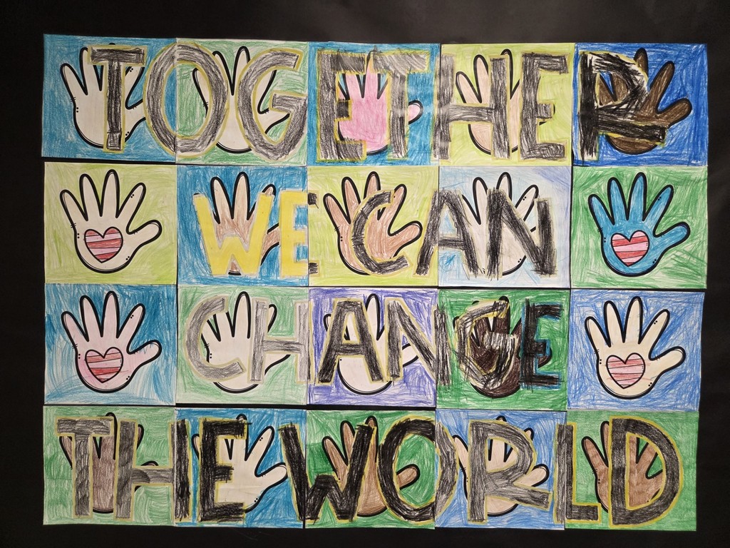 A quilt like poster made by !st grade students that reads "TOGETHER WE CAN CHANGE THE WORLD"