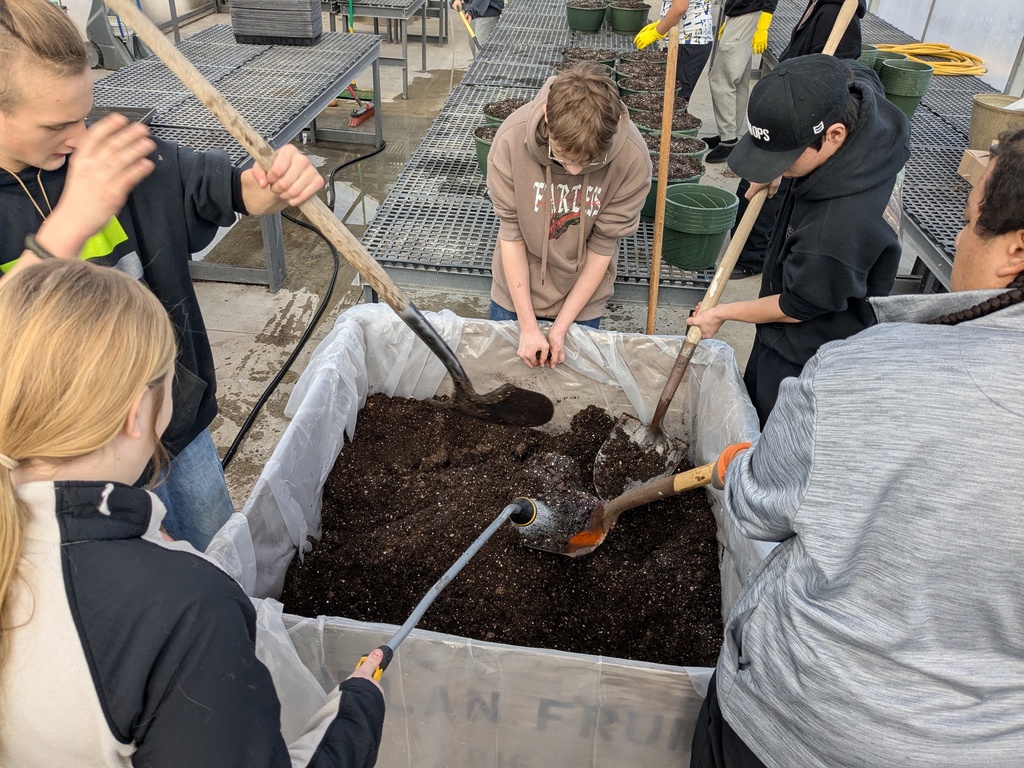 Students mix different soil media with slow-release fertilizer to prepare a supportive home for our new plants.