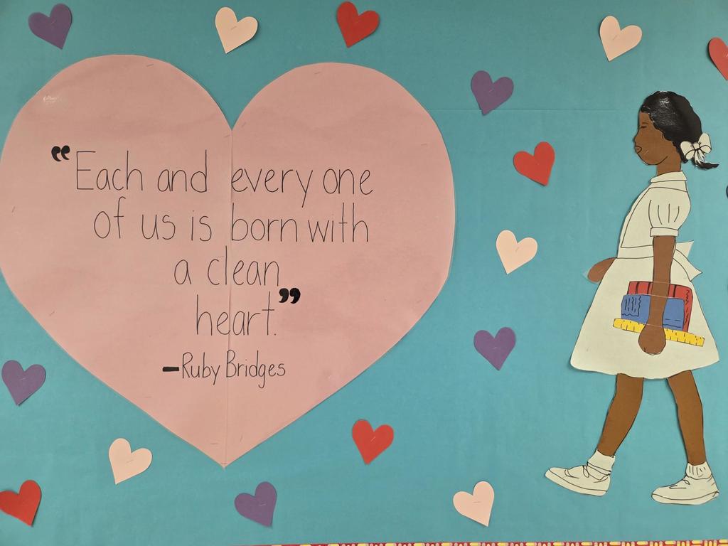 Large heart with the saying "Each and every one of us is born with a clean heart" by Ruby Bridges