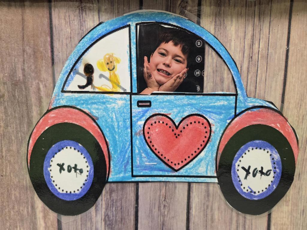 A love bug with a student photo and drawing.