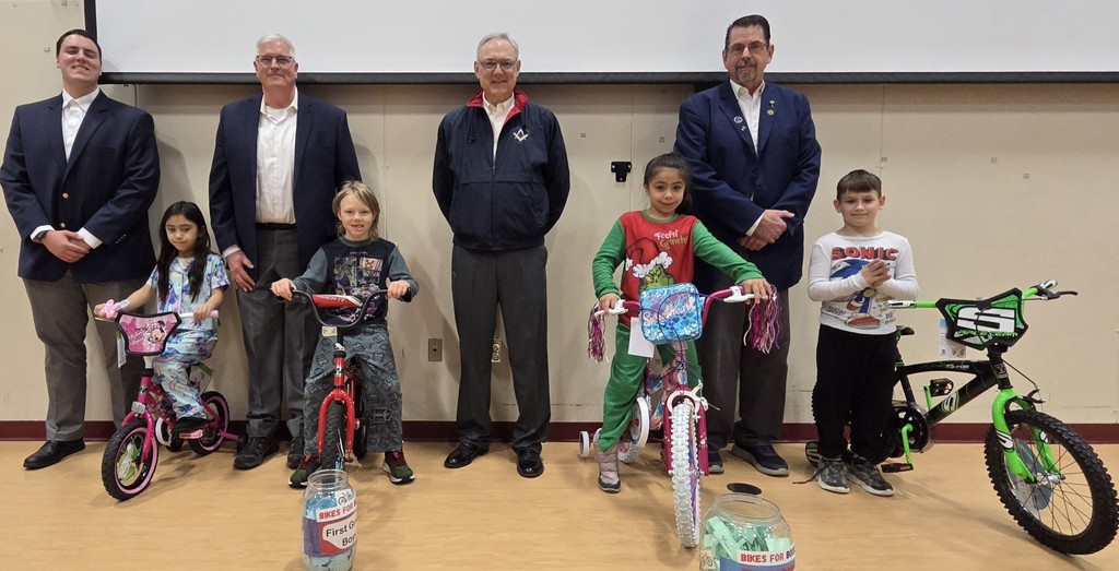 The Masons stand with the winners of this years Bikes for Books.